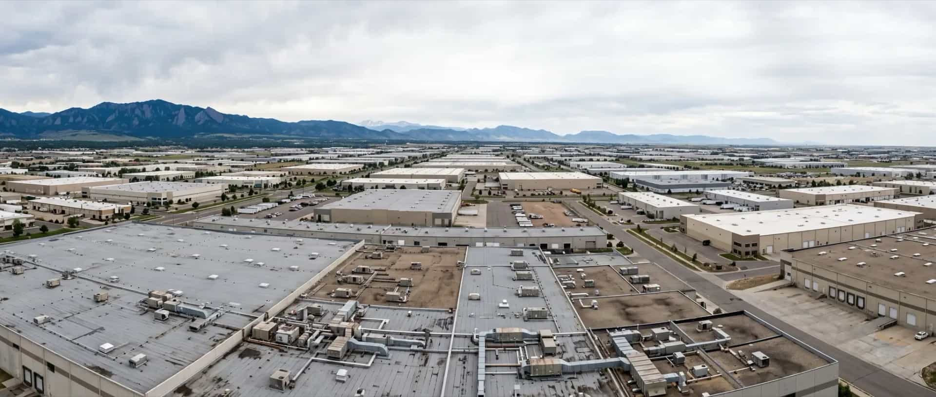 Illustrative representation of large flat low-slope commercial and industrial rooftops in Commerce City, Colorado