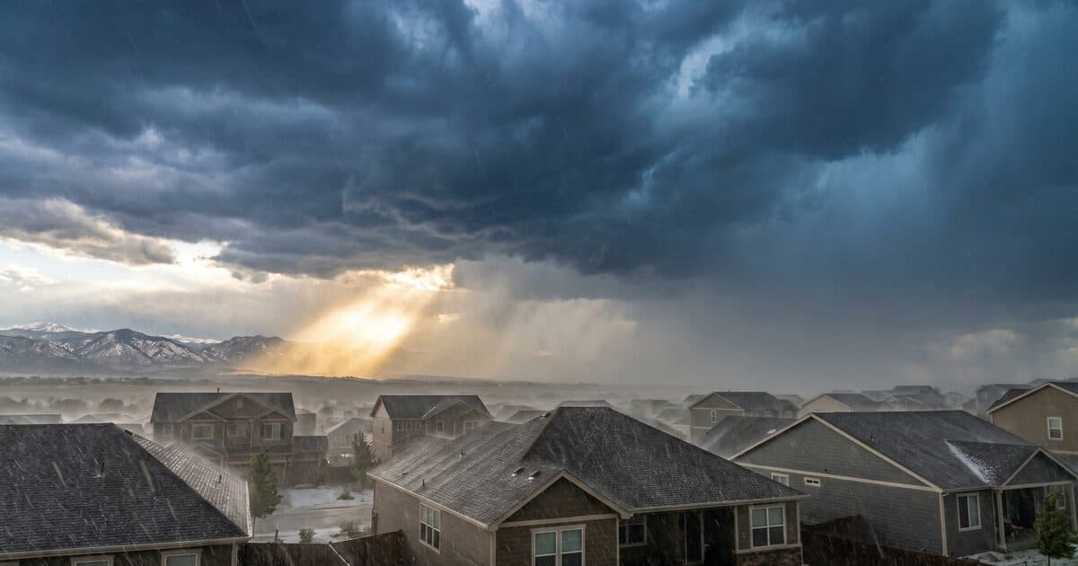 Hail storm over a Colorado neighborhood rooftop