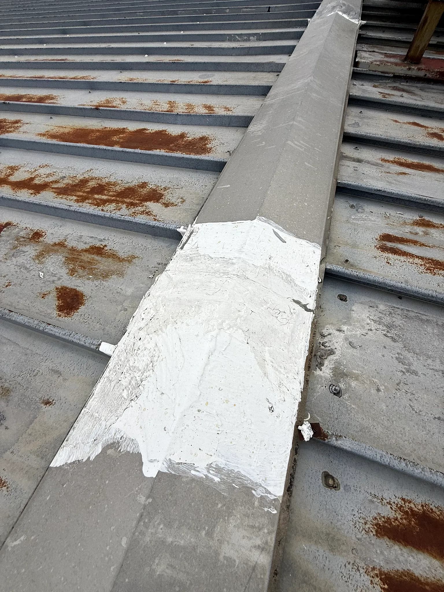 Treated seam and rib detail on a metal roof during an American WeatherStar coating restoration in Denver, Colorado