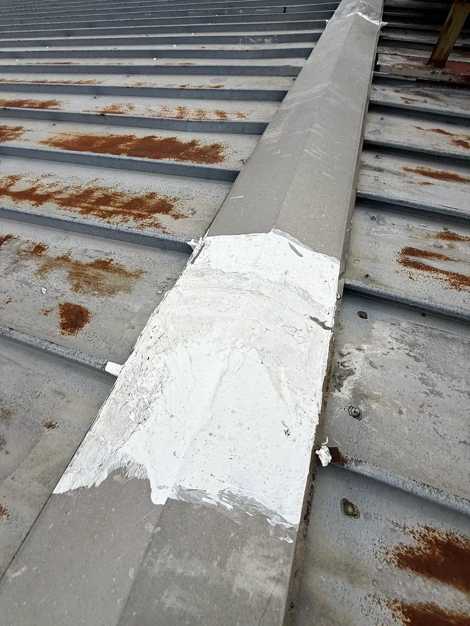 Treated seam and rib detail on a metal roof during an American WeatherStar coating restoration in Denver, Colorado
