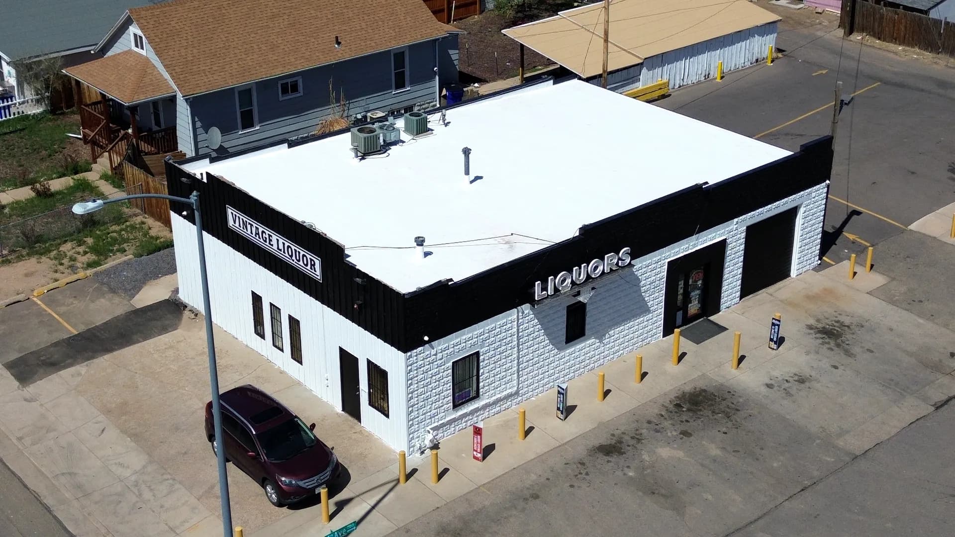 Aerial view of a completed white Johns Manville TPO commercial roof in Greeley, Colorado