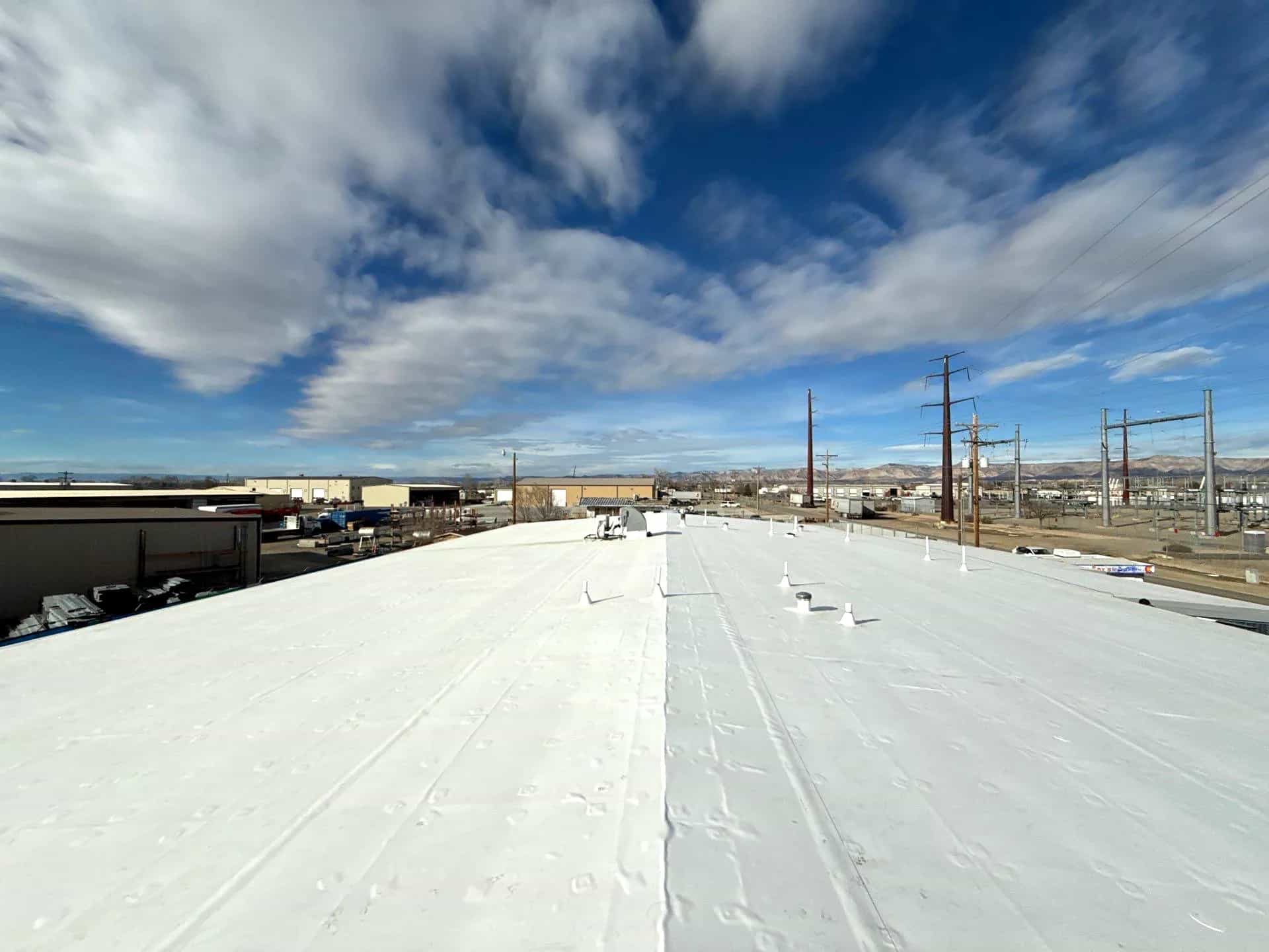 Aerial view of a completed commercial roofing project in Grand Junction, Colorado