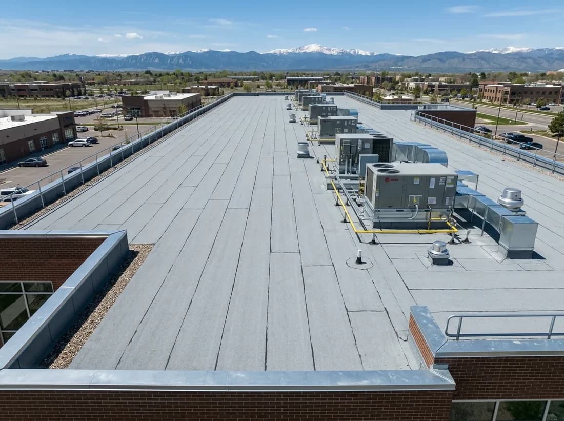 Illustrative representation of a modified bitumen roof with a granulated cap sheet on a Colorado commercial building