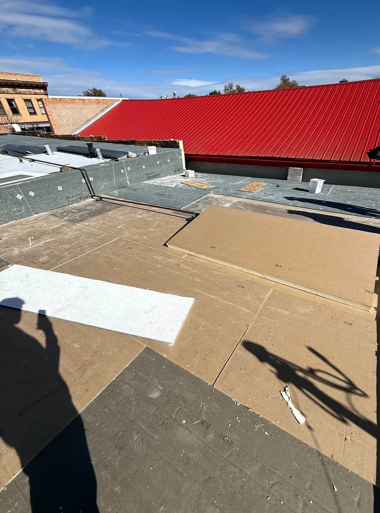 CRC crew installing the Johns Manville cover board and preparing the substrate for a new TPO membrane on a commercial roof in Fruita, Colorado