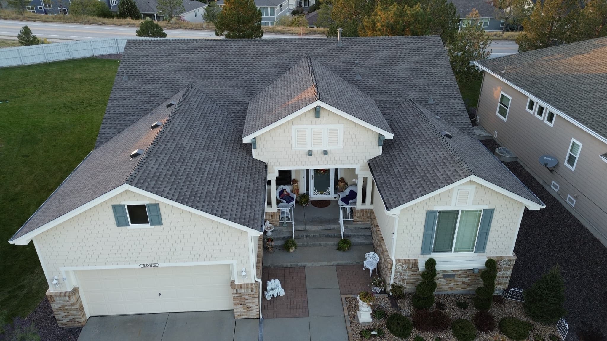 CRC crew installing GAF Class 4 impact-resistant shingles on a home in Castle Pines, Colorado
