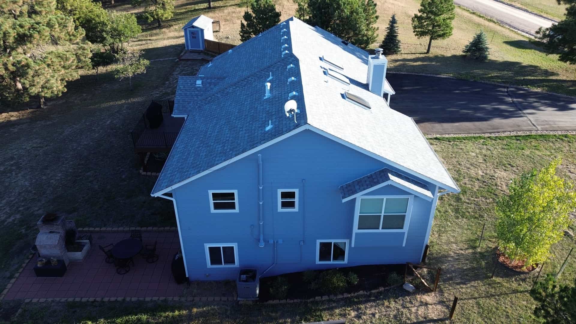 Aerial view of a completed residential roof restoration after hail damage on a home in Elizabeth, Colorado