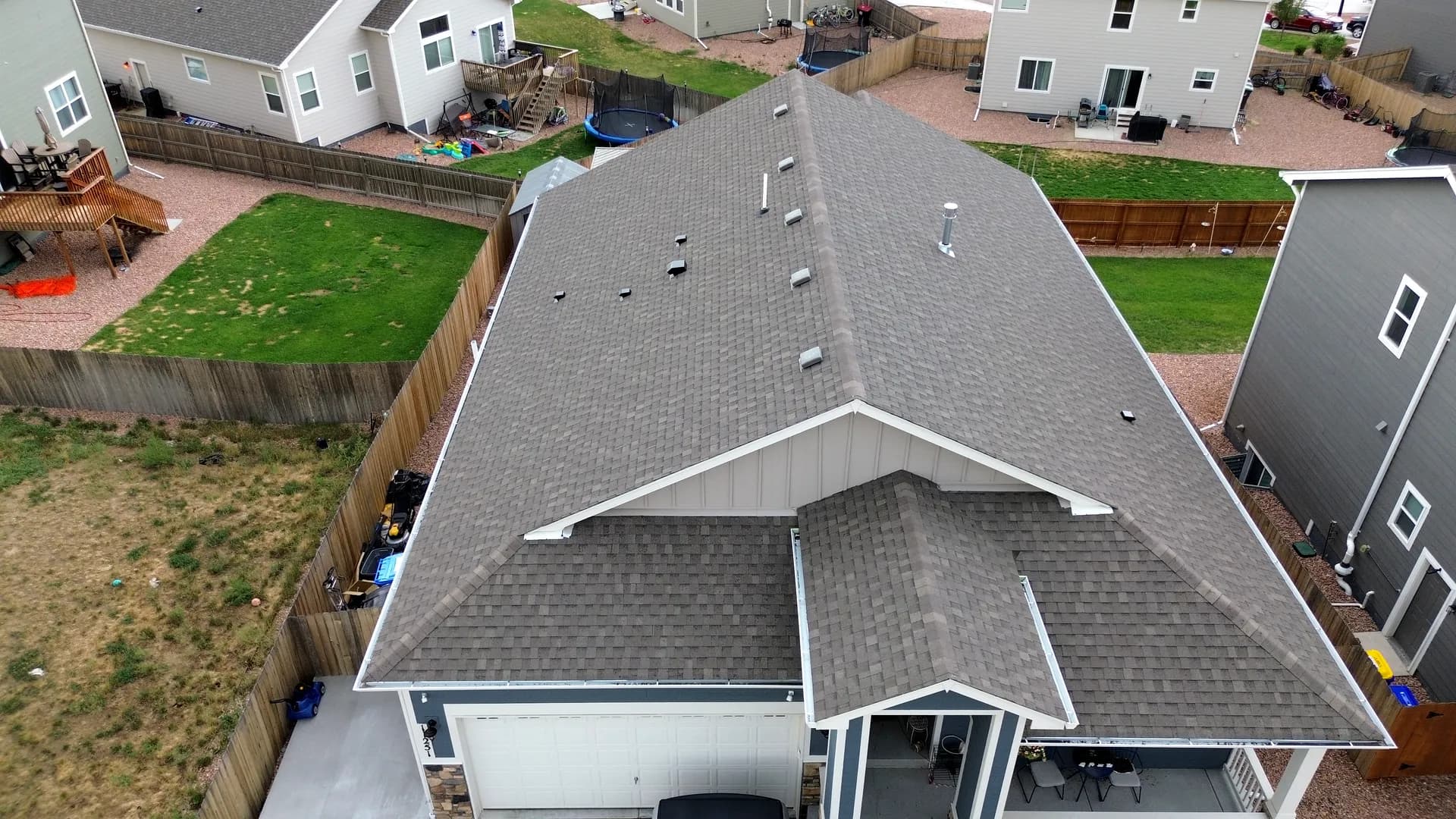Aerial view of a completed architectural asphalt shingle roof on a home in Colorado Springs, Colorado