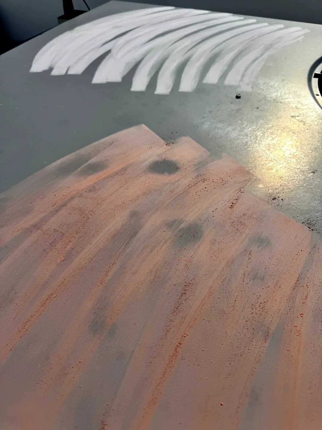 Hail impact dents circled in chalk on a painted metal surface at a Cherry Creek storefront in Denver, Colorado, documenting storm damage for an insurance claim