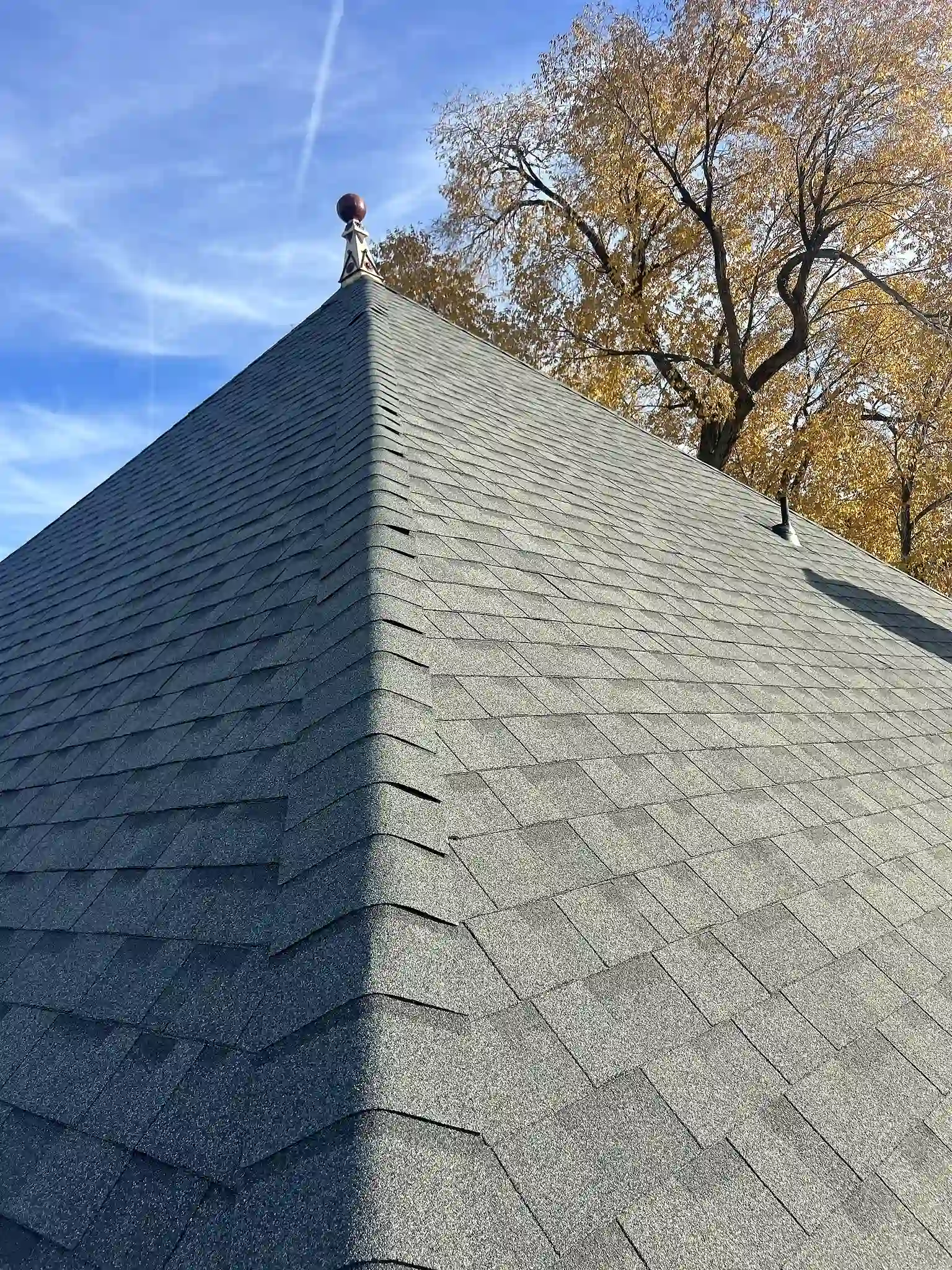 Completed Owens Corning Oakridge architectural shingle roof in Estate Gray on a historic Grand Junction home