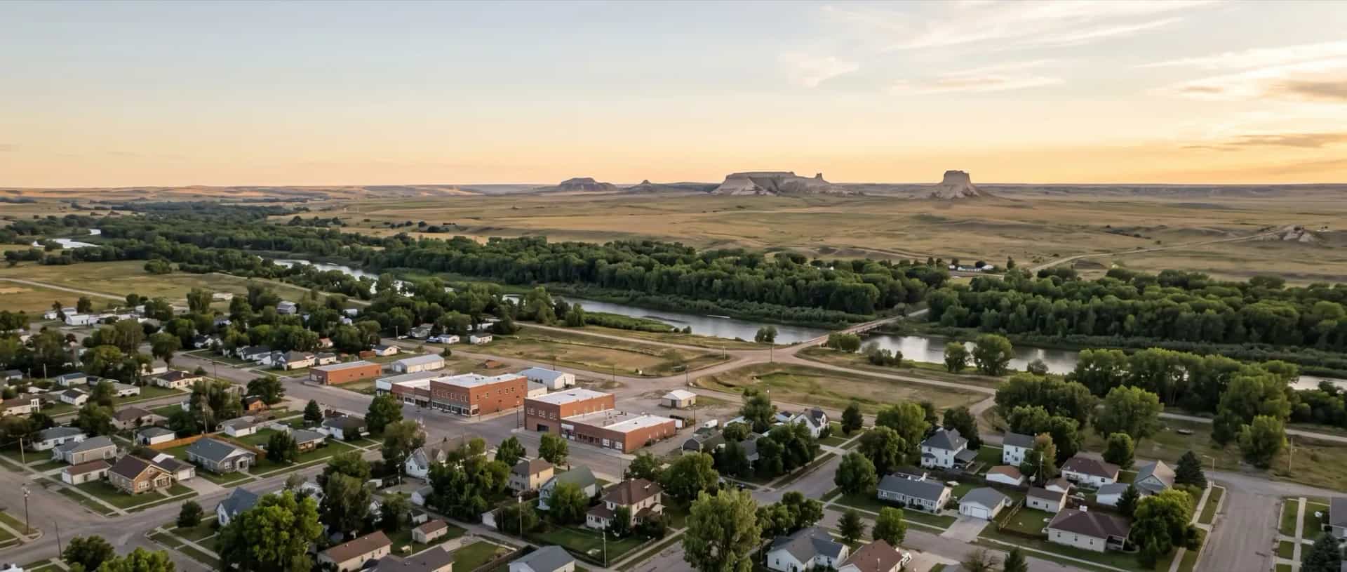 Illustrative representation of a small town beside the North Platte River at Bridgeport, Nebraska, with bluffs rising from the surrounding rangeland