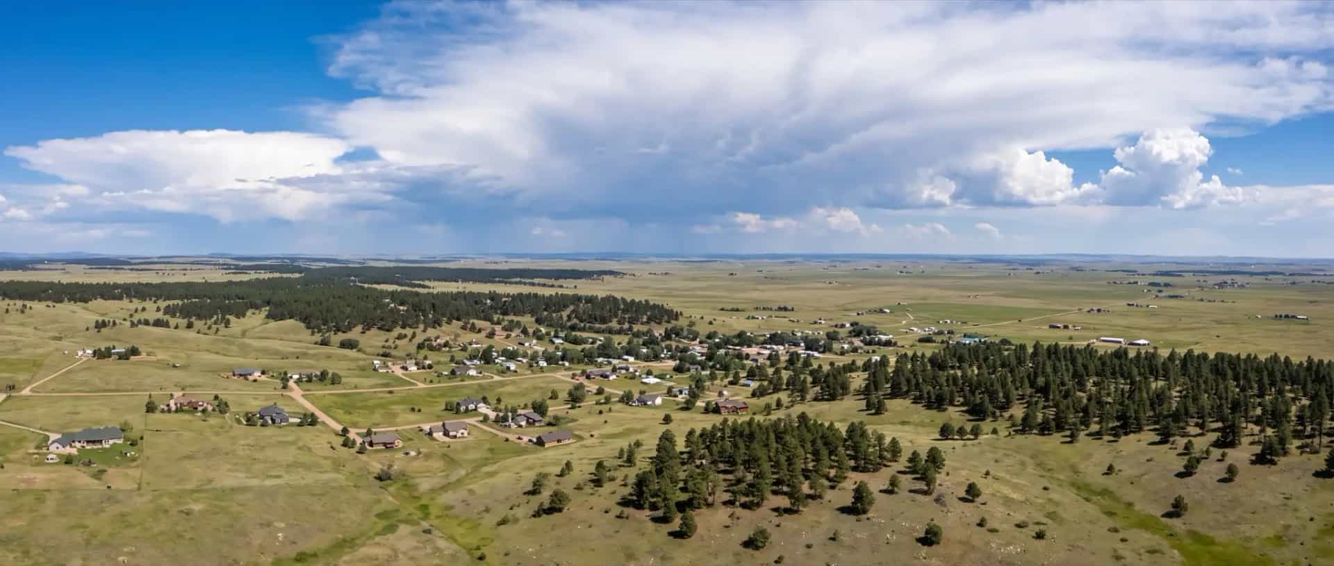 Illustrative representation of scattered rural rooftops on the high rolling grassland of the Palmer Divide near Elizabeth, Colorado