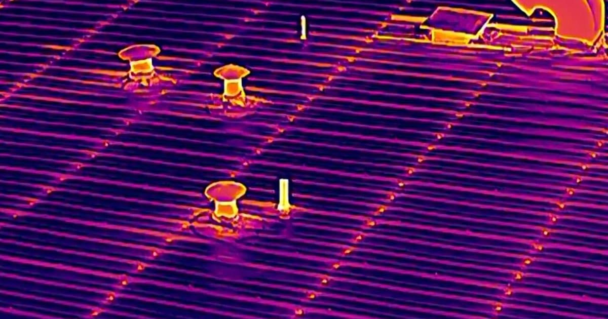 Drone thermal infrared scan of a commercial metal roof in Grand Junction, Colorado showing warm leak and moisture hot spots